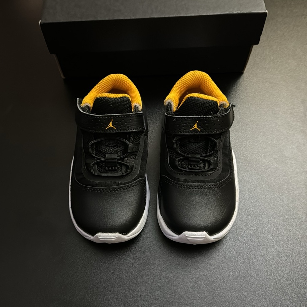 Toddler Jordan’s in colors Black and Taxi White